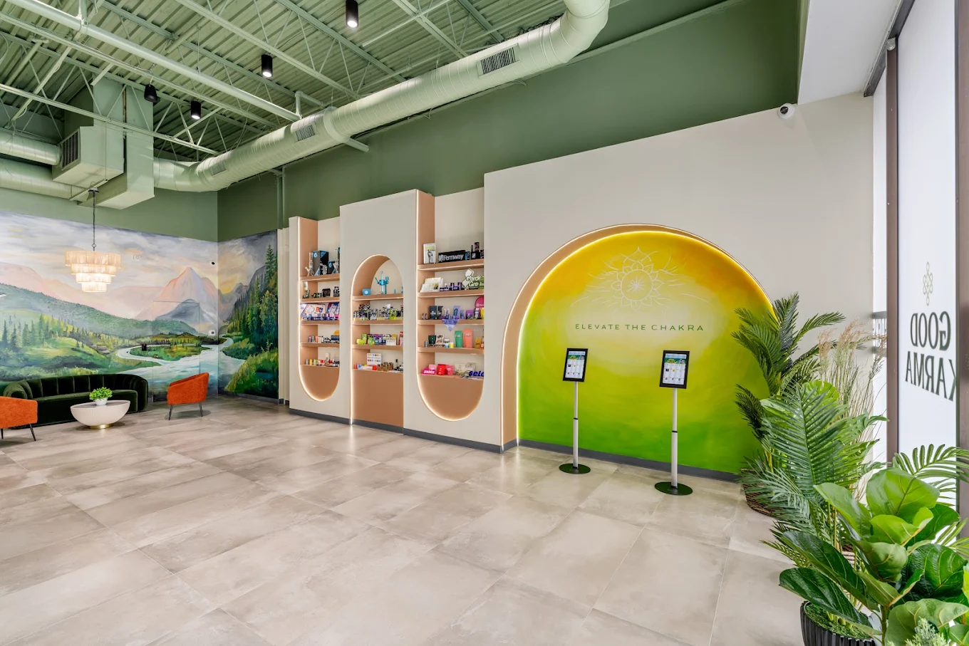 Interior of a cannabis dispensary with shelves and digital screens on stands